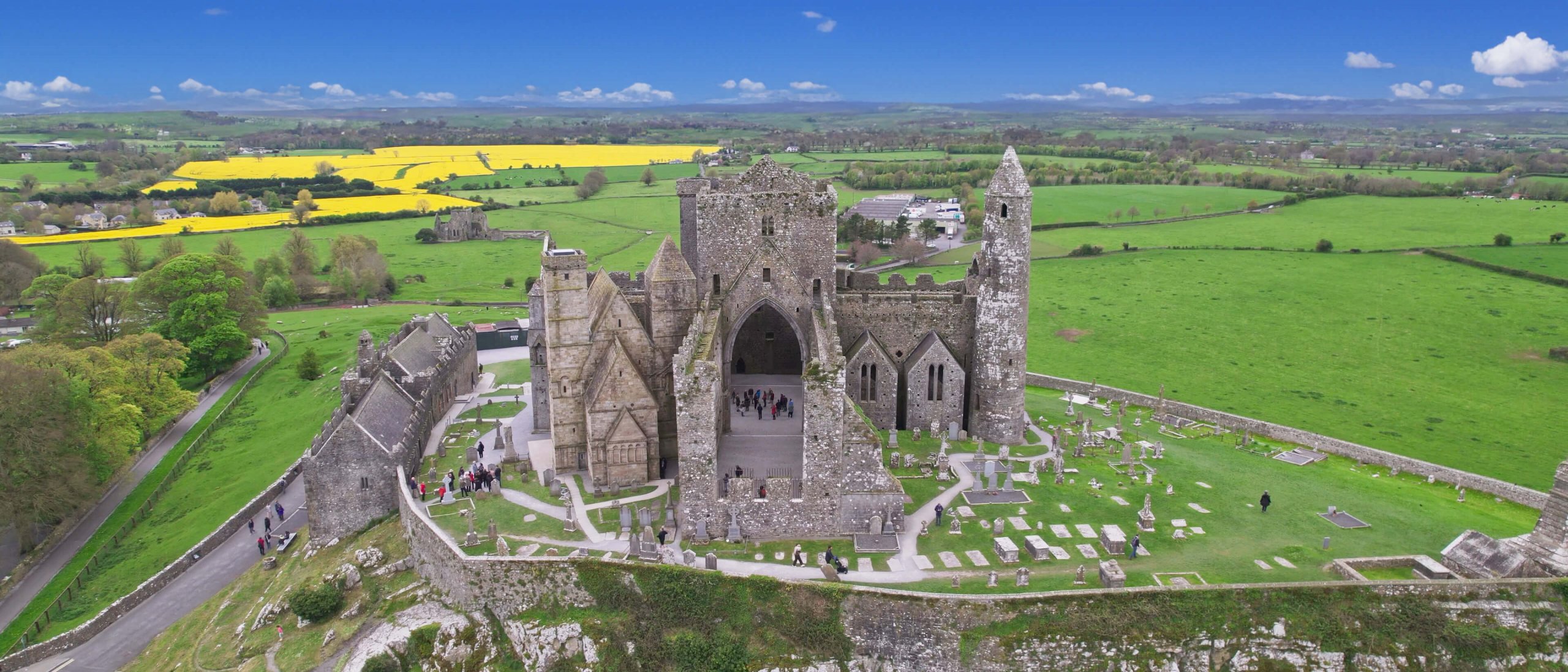 rock of cashel from an aerial view with a blue sky